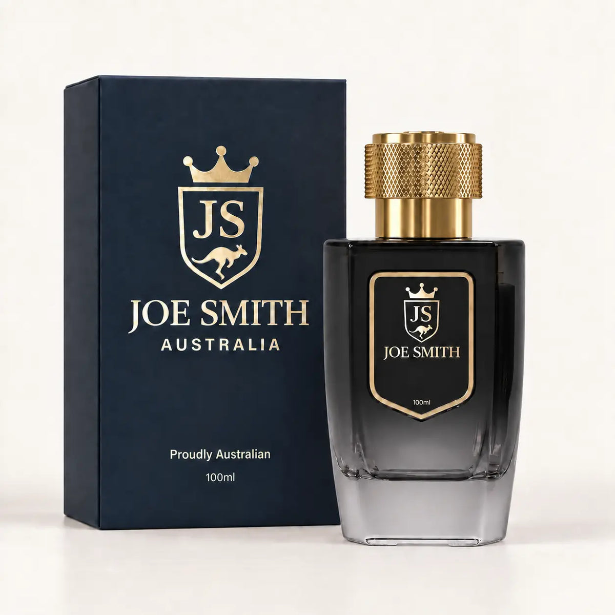 Joe Smith 100 ml black perfume bottle with gold cap beside its navy presentation box