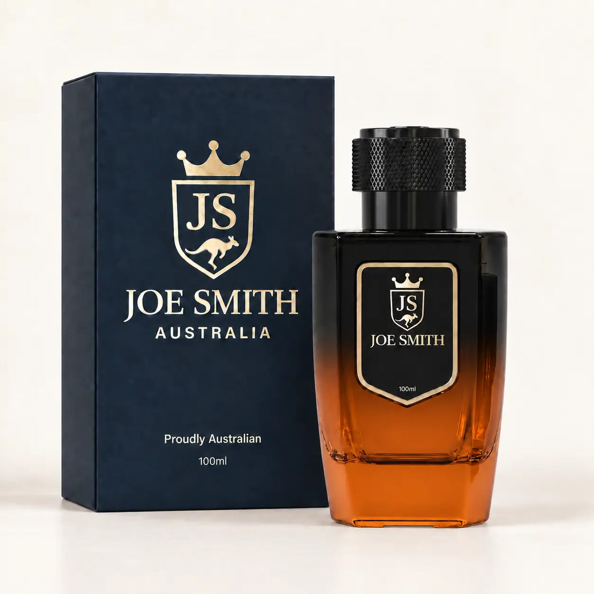 Joe Smith 100 ml black-to-orange perfume bottle with black cap beside its navy presentation box