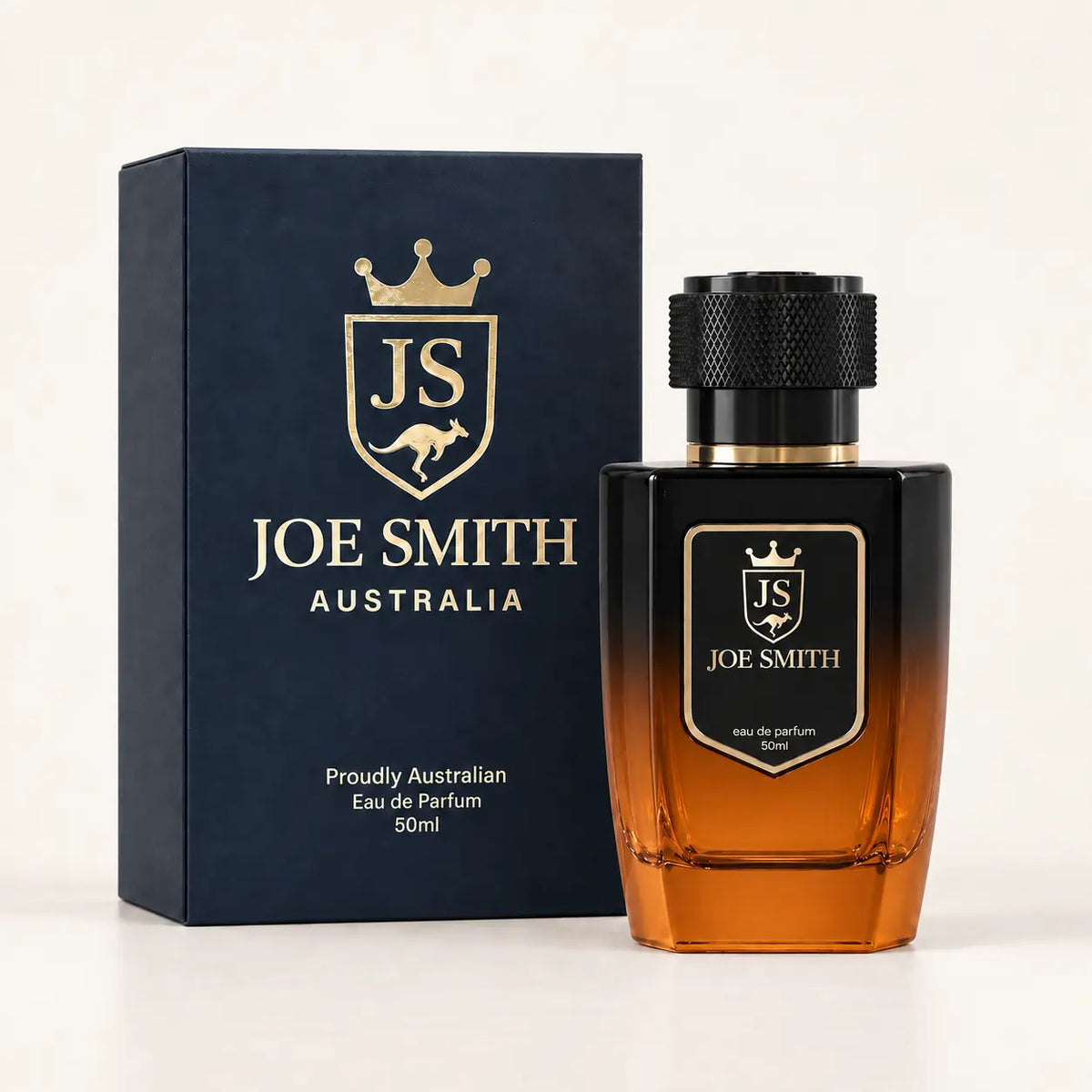 Joe Smith 50 ml black-to-orange perfume bottle with black cap beside its navy presentation box