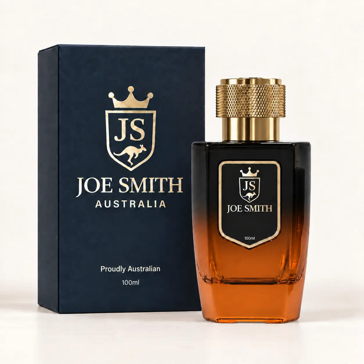 Joe Smith 100 ml black-to-orange perfume bottle with gold cap beside its navy presentation box