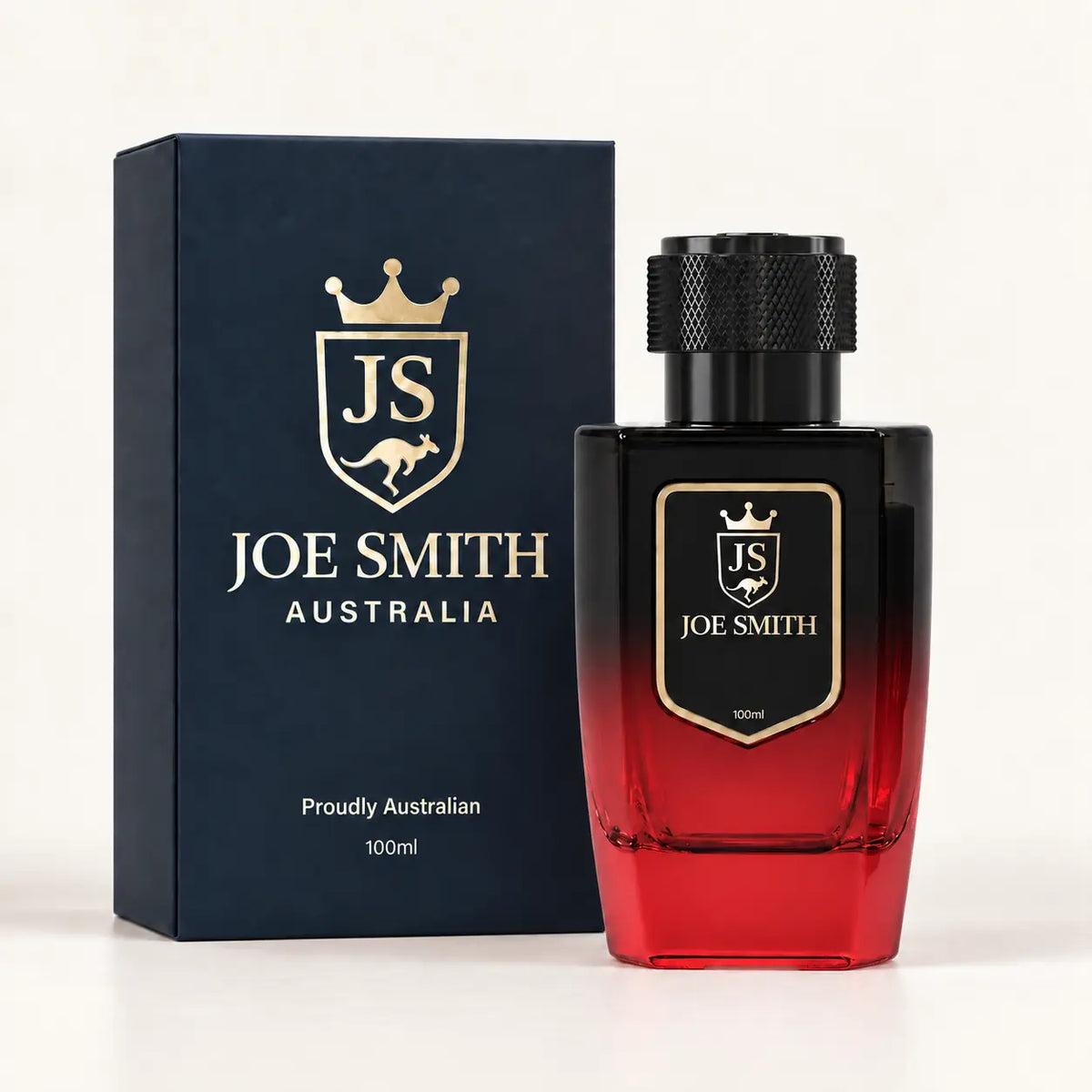 Joe Smith 100 ml black-to-red perfume bottle with black cap beside its navy presentation box