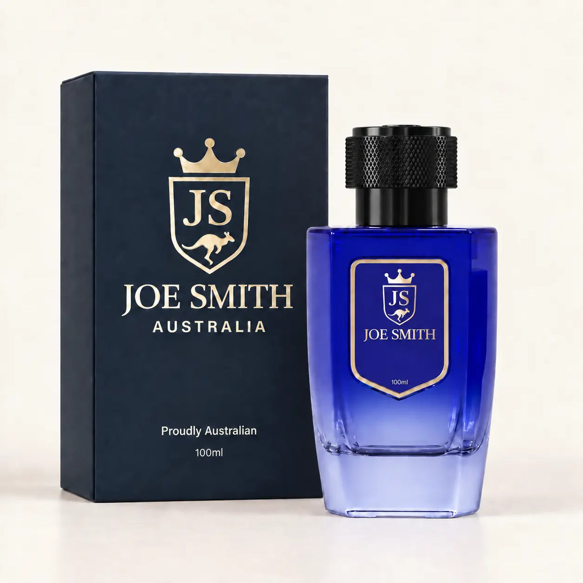 Joe Smith 100 ml royal blue perfume bottle with black cap beside its navy presentation box