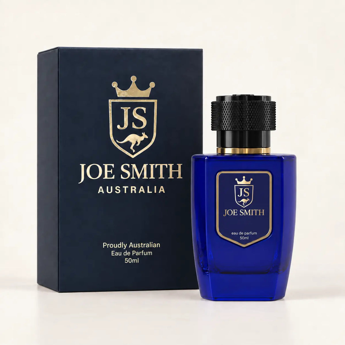 Joe Smith 50 ml royal blue perfume bottle with black cap beside its navy presentation box