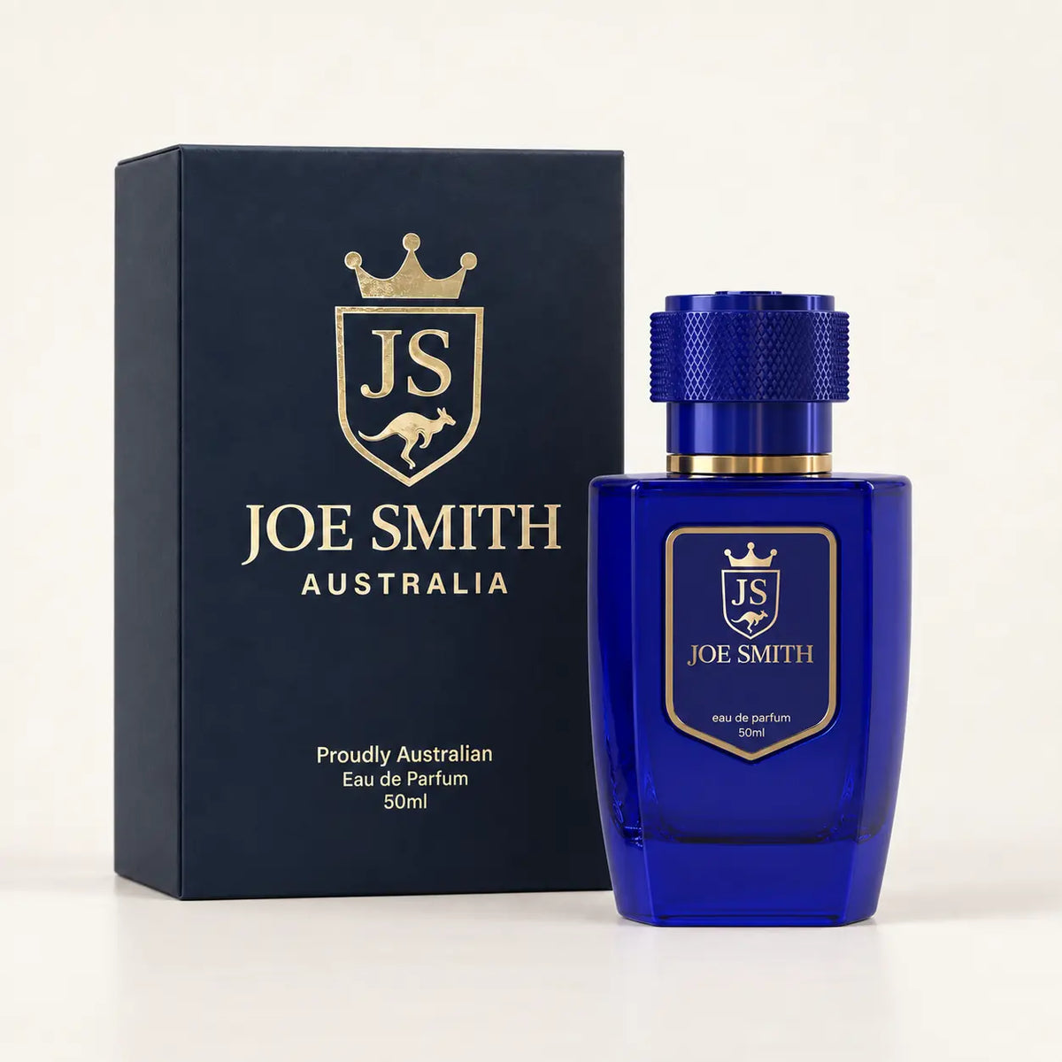 Joe Smith 50 ml royal blue perfume bottle with blue cap beside its navy presentation box