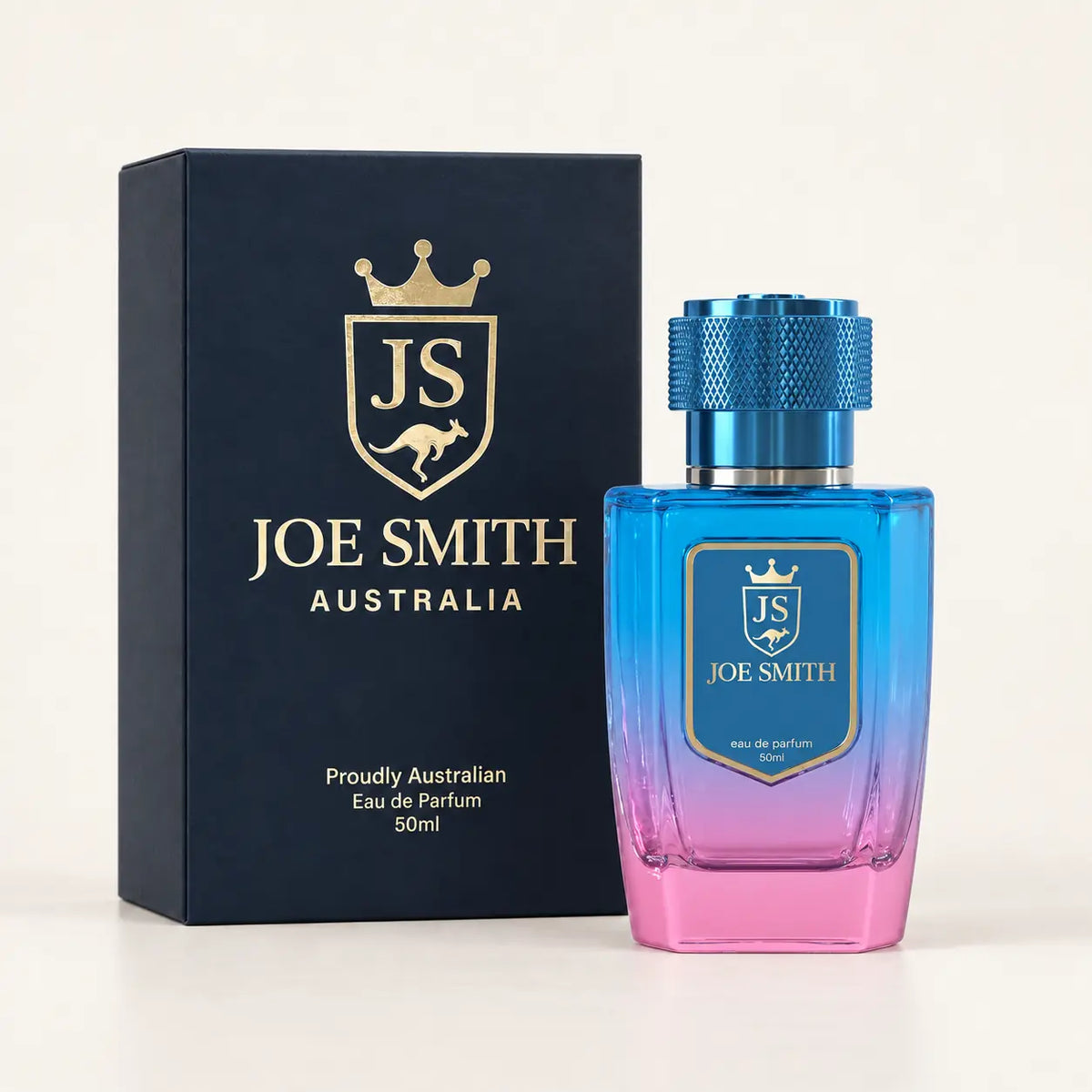 Joe Smith 50 ml blue-to-pink perfume bottle with blue cap beside its navy presentation box