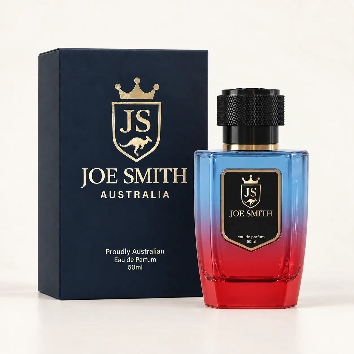 Joe Smith 50 ml blue-to-red perfume bottle with black cap beside its navy presentation box