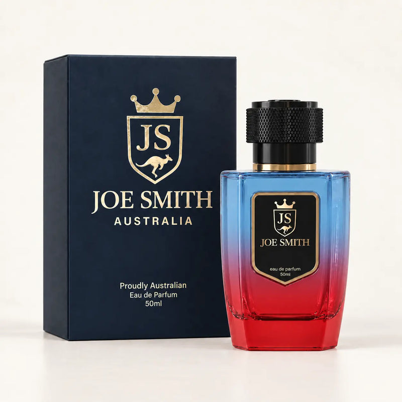 Joe Smith 50 ml blue-to-red perfume bottle with black cap beside its navy presentation box