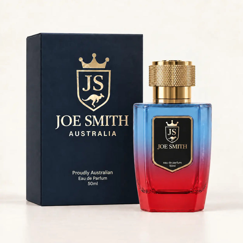 Joe Smith 50 ml blue-to-red perfume bottle with gold cap beside its navy presentation box