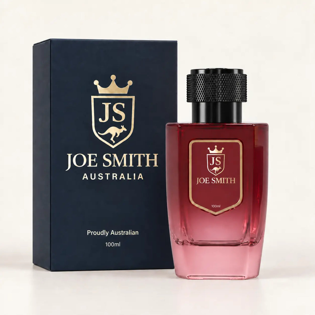 Joe Smith 100 ml burgundy perfume bottle with black cap beside its navy presentation box