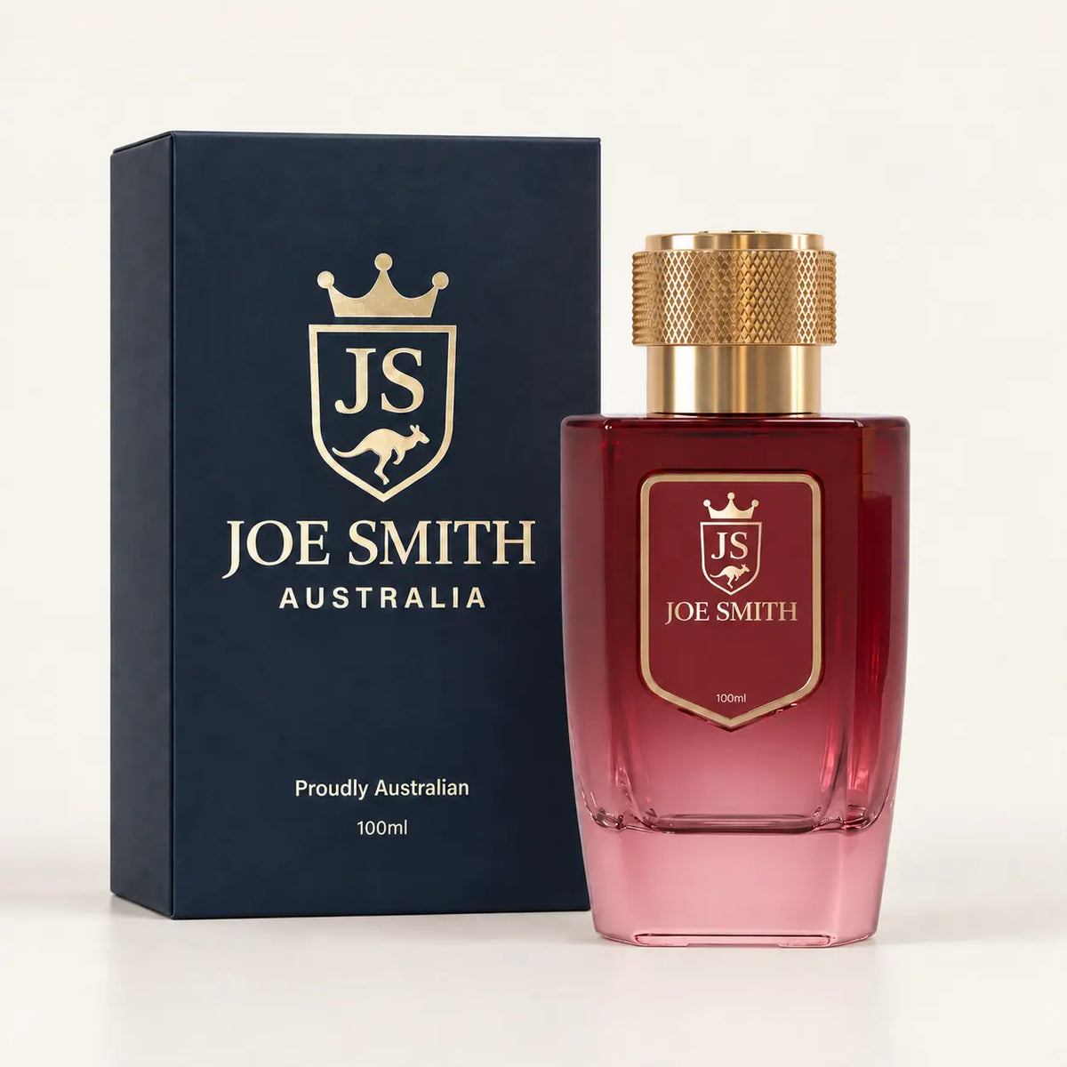 Joe Smith 100 ml burgundy perfume bottle with gold cap beside its navy presentation box