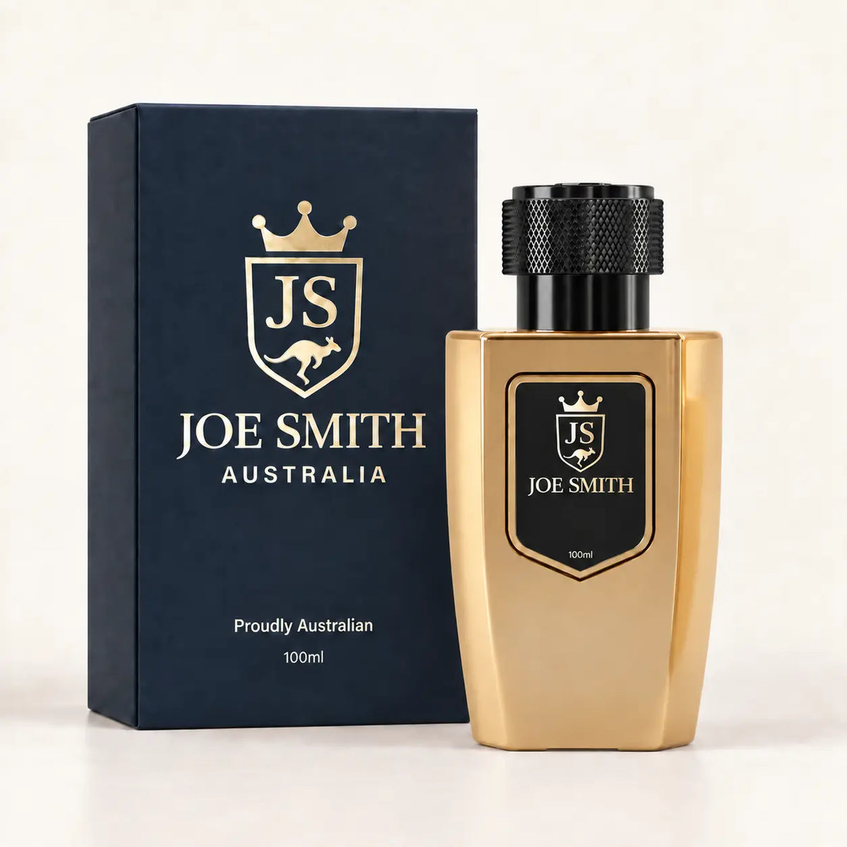 Joe Smith 100 ml gold perfume bottle with black cap beside its navy presentation box