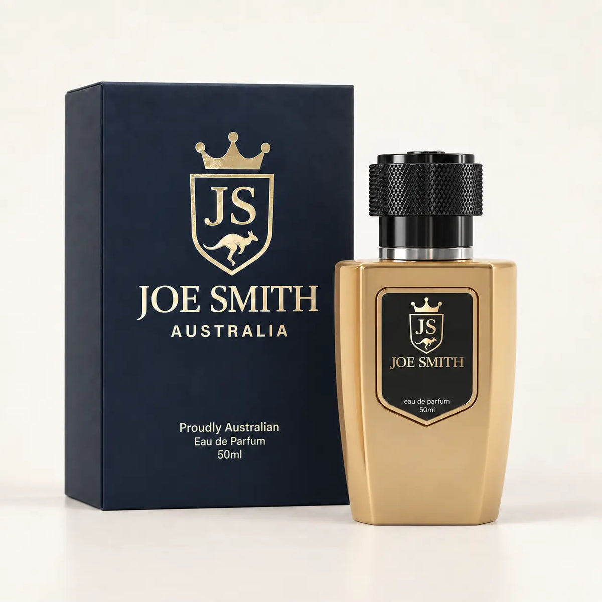 Joe Smith 50 ml gold perfume bottle with black cap beside its navy presentation box