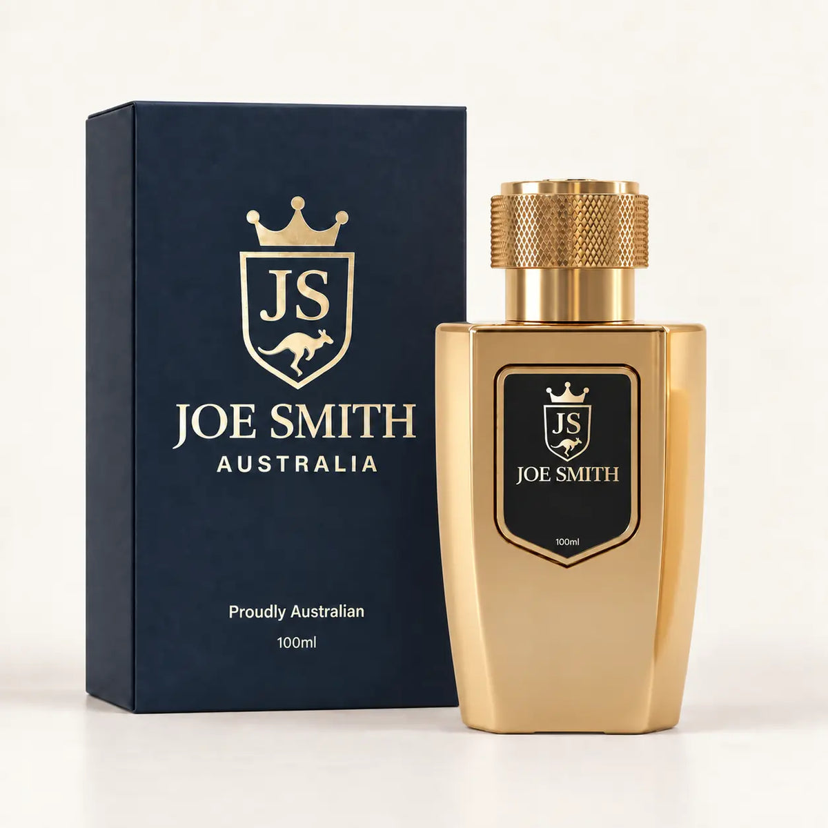 Joe Smith 100 ml gold perfume bottle with gold cap beside its navy presentation box