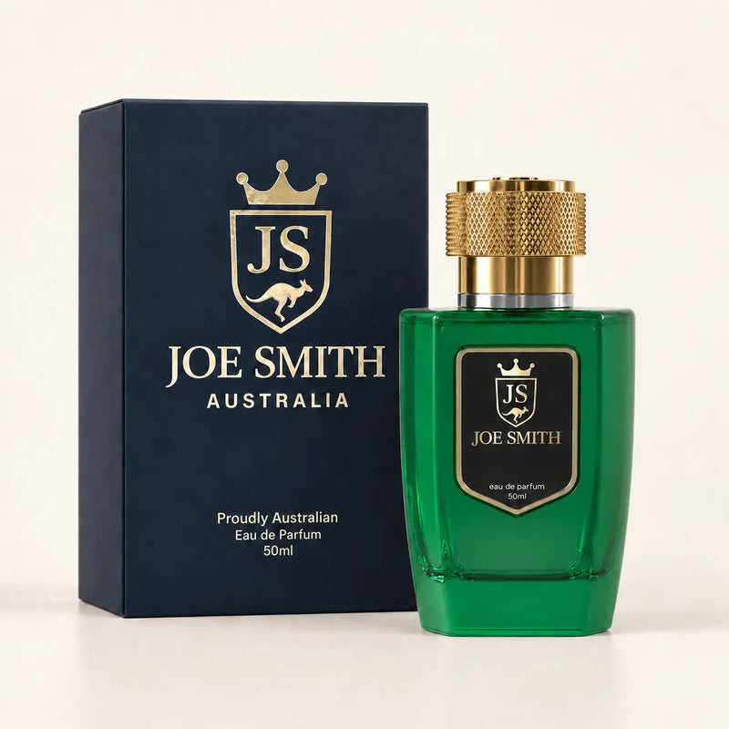 Joe Smith 50 ml green perfume bottle with gold cap beside its navy presentation box