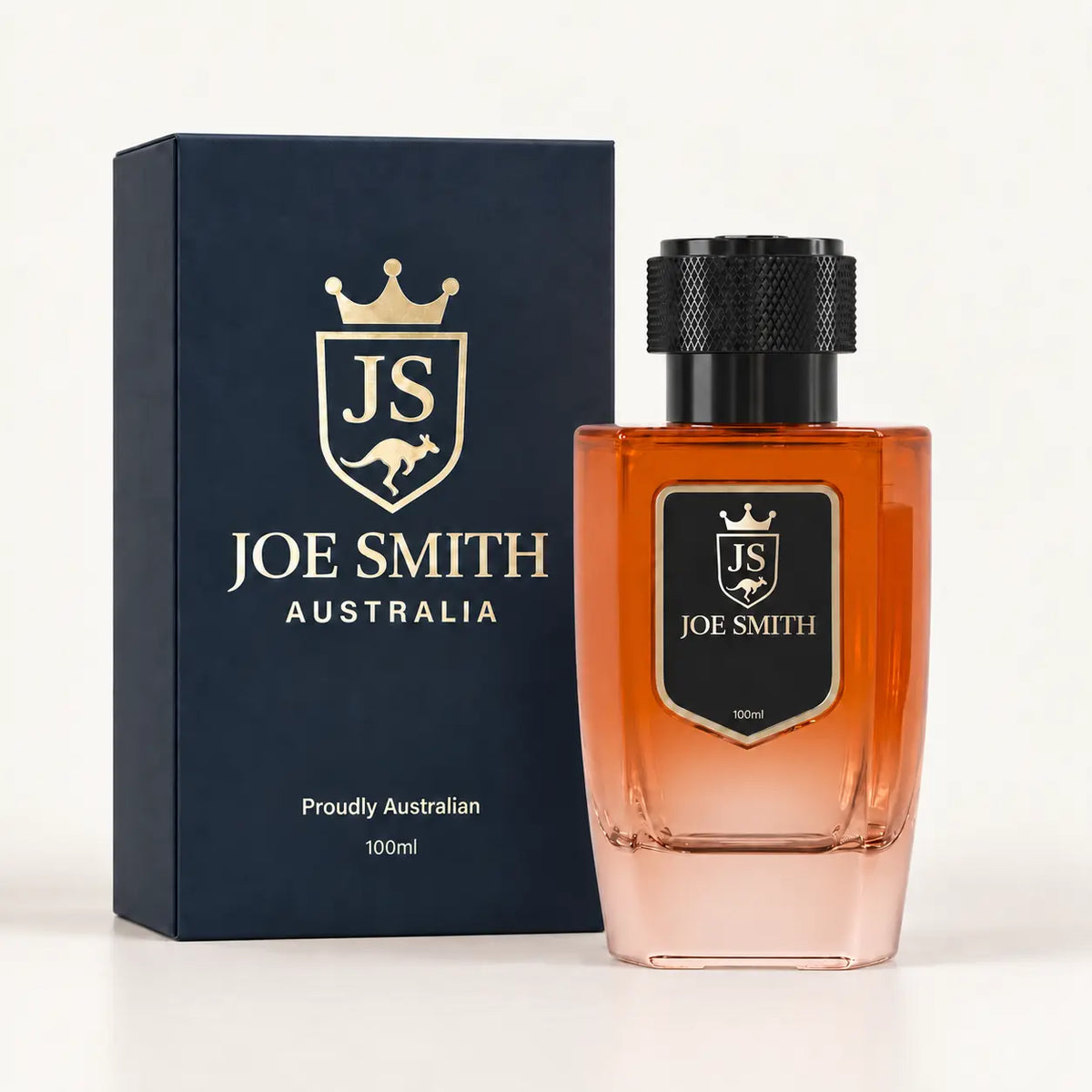 Joe Smith 100 ml orange perfume bottle with black cap beside its navy presentation box