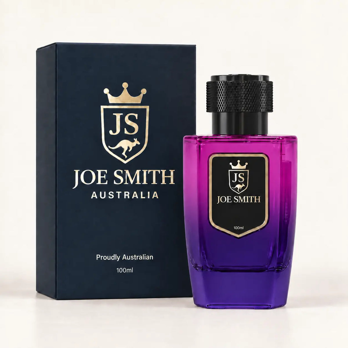 Joe Smith 100 ml magenta-to-purple perfume bottle with black cap beside its navy presentation box