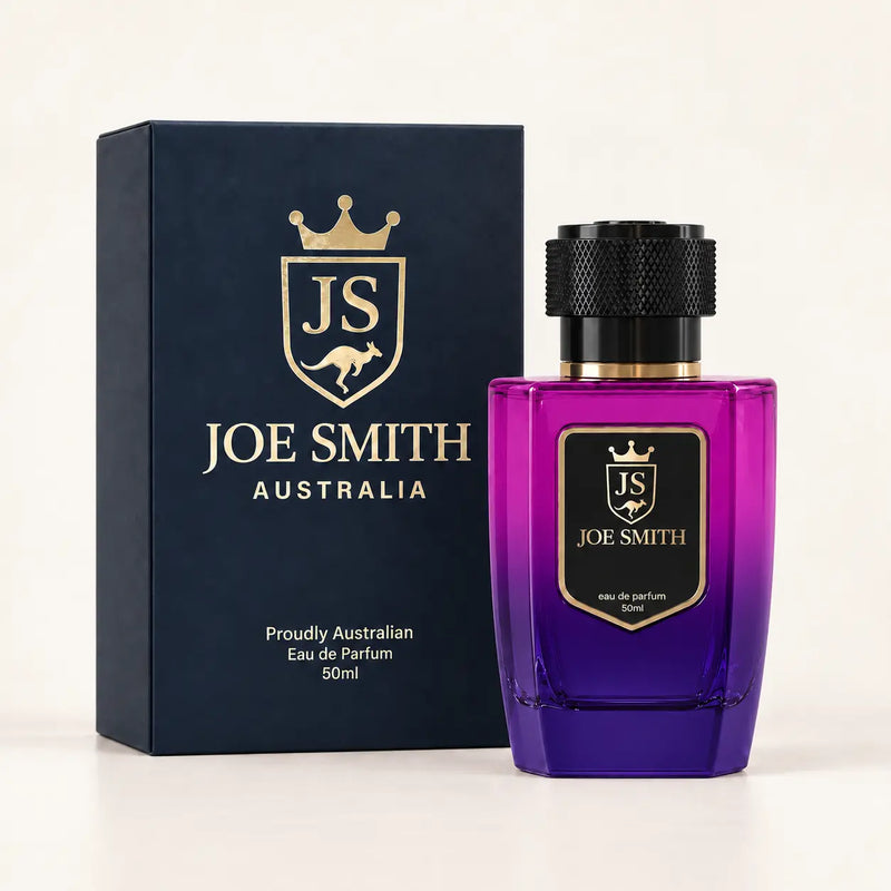 Joe Smith 50 ml magenta-to-purple perfume bottle with black cap beside its navy presentation box